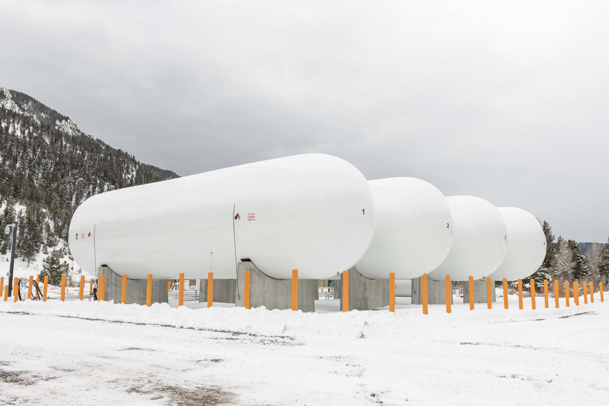 Big white propane tanks hibernating majestically in the snow