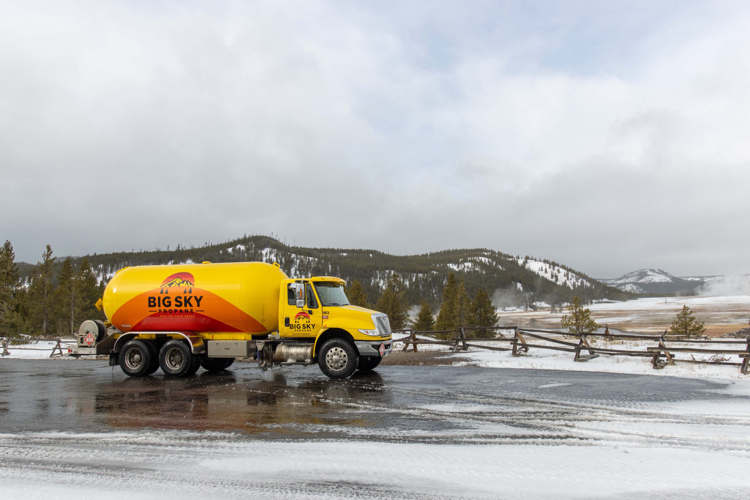 Yellow delivery truck in winter